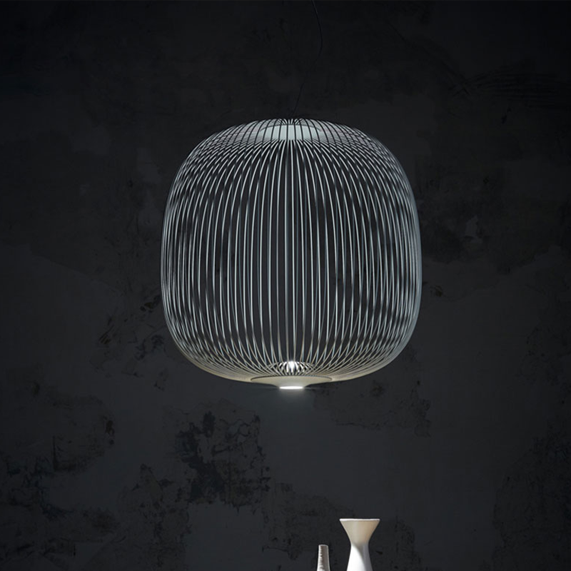 The Spokes 2 Pendant from Foscarini in large matte black hangs in a primary bedroom.