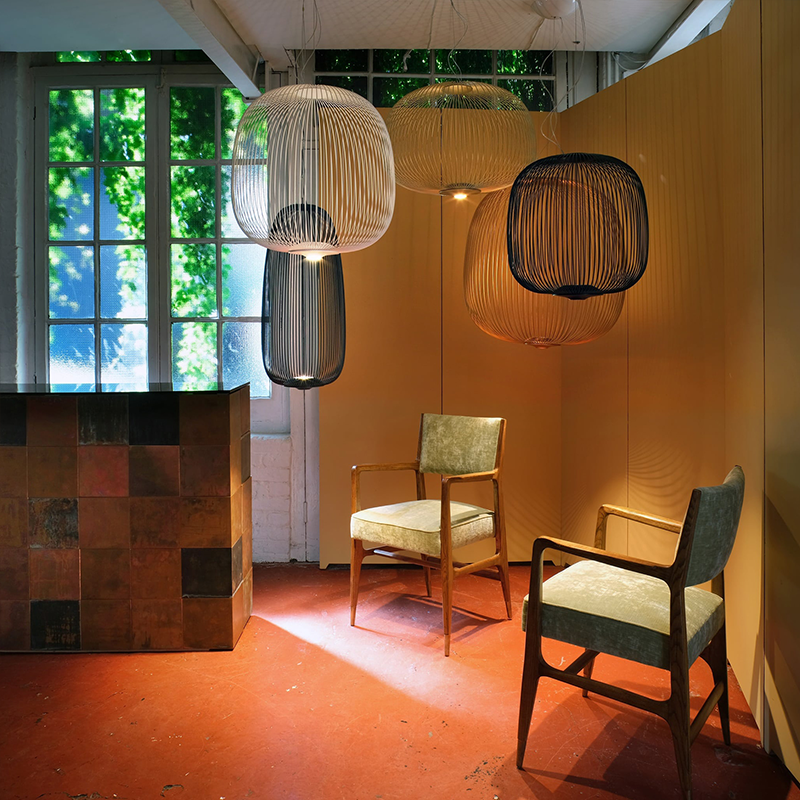 The Spokes 2 Pendant from Foscarini in a reading room.