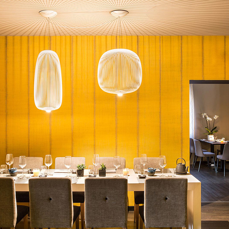 The Spokes 2 Pendant from Foscarini in white in a family area.