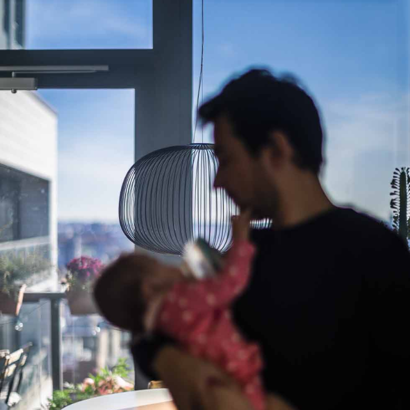 The Spokes 3 by Foscarini in black in a family area.