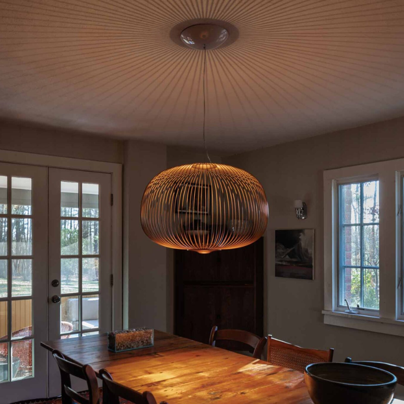 The Spokes 3 by Foscarini in gold in a living space.