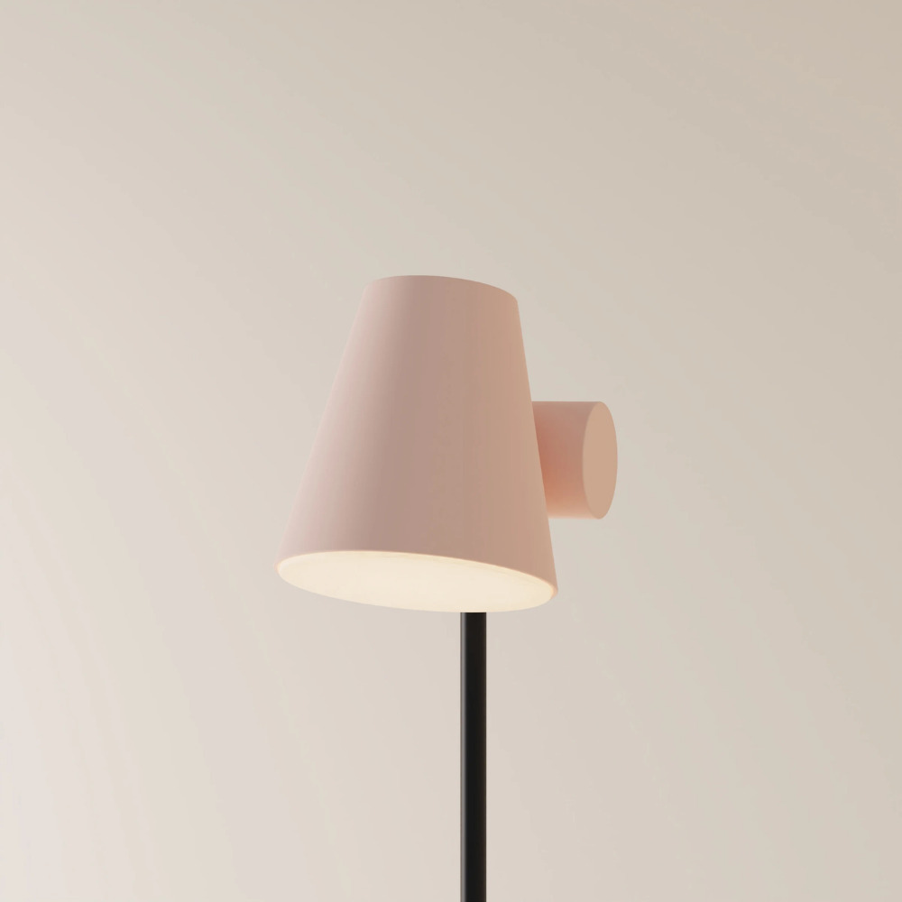 The coral Aim Floor Light from Gantri with the black rod option.
