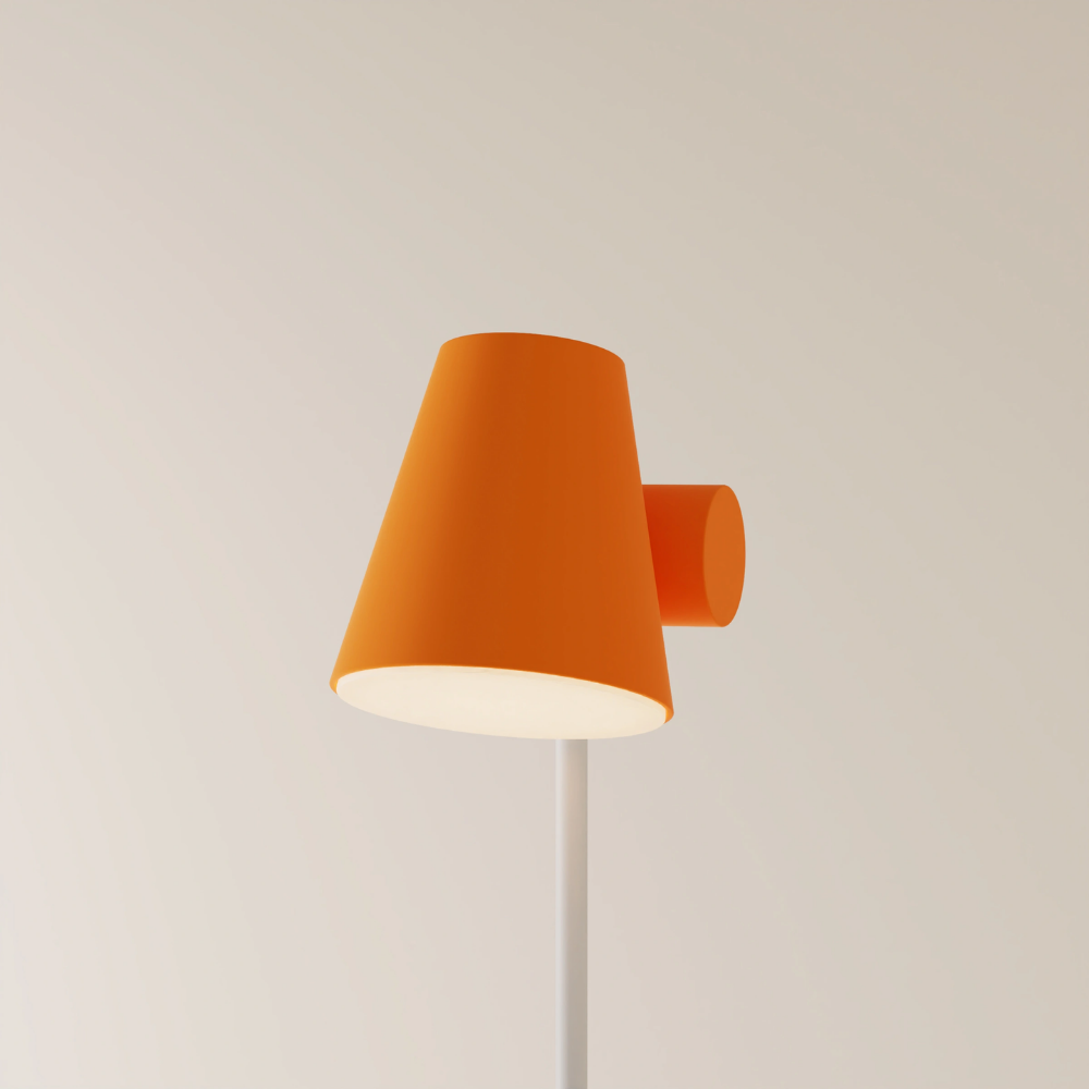 The persimmon Aim Floor Light from Gantri with the white rod option.