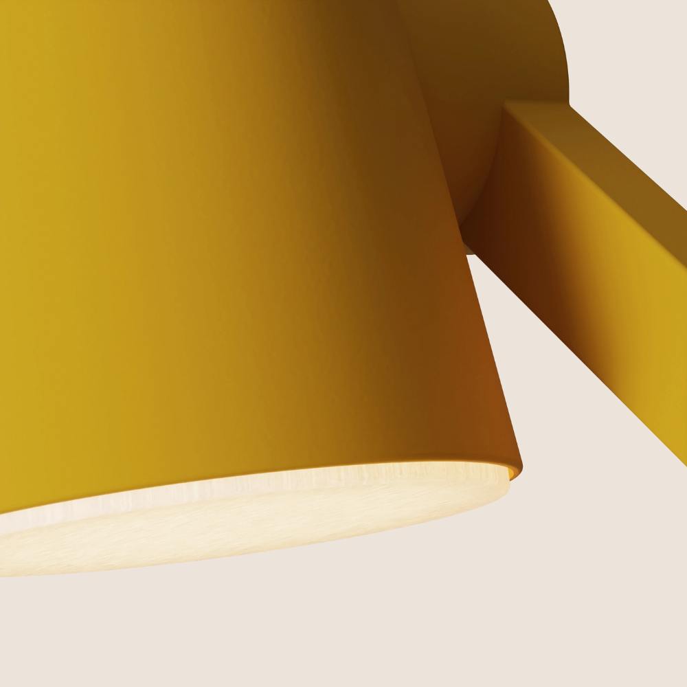 The mustard Aim Task Light from Gantri close up.