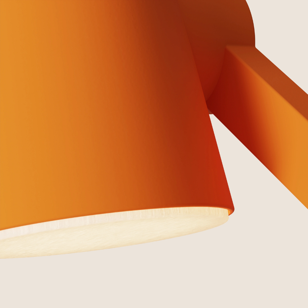 The persimmon Aim Task Light from Gantri close up.