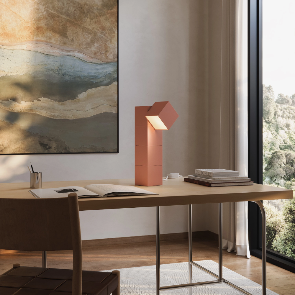 The blossom Analog Task Light from Gantri in a home office on top of a desk.