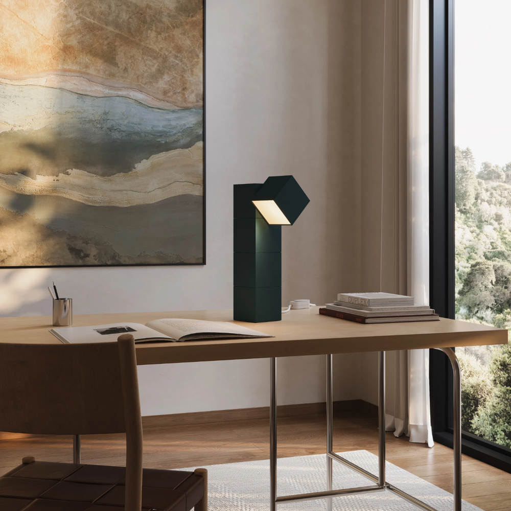 The forest Analog Task Light from Gantri in a home office on top of a desk.