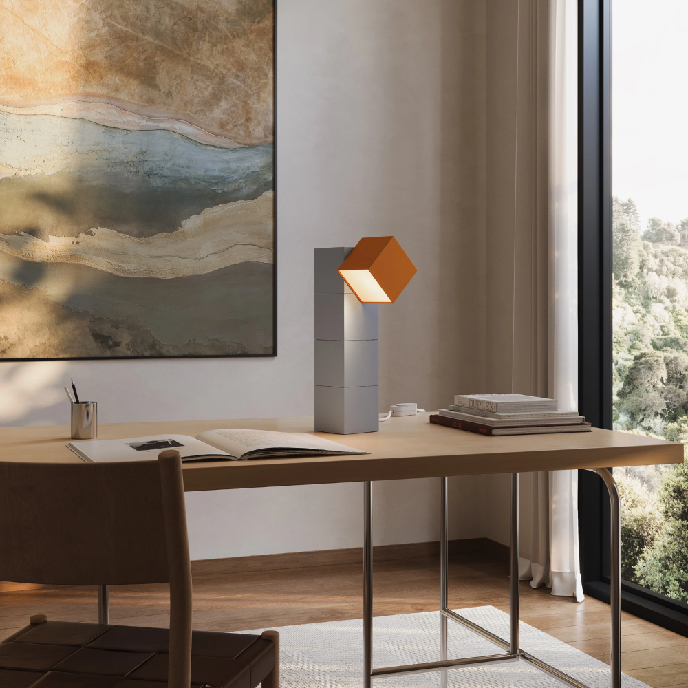 The stone Analog Task Light from Gantri in a home office on top of a desk.