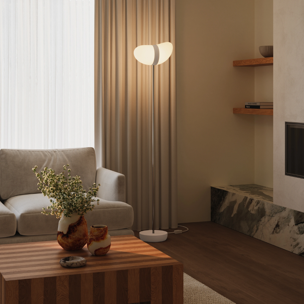 The peach Baltra Floor Light from Gantri with the chrome rod option in a family space.