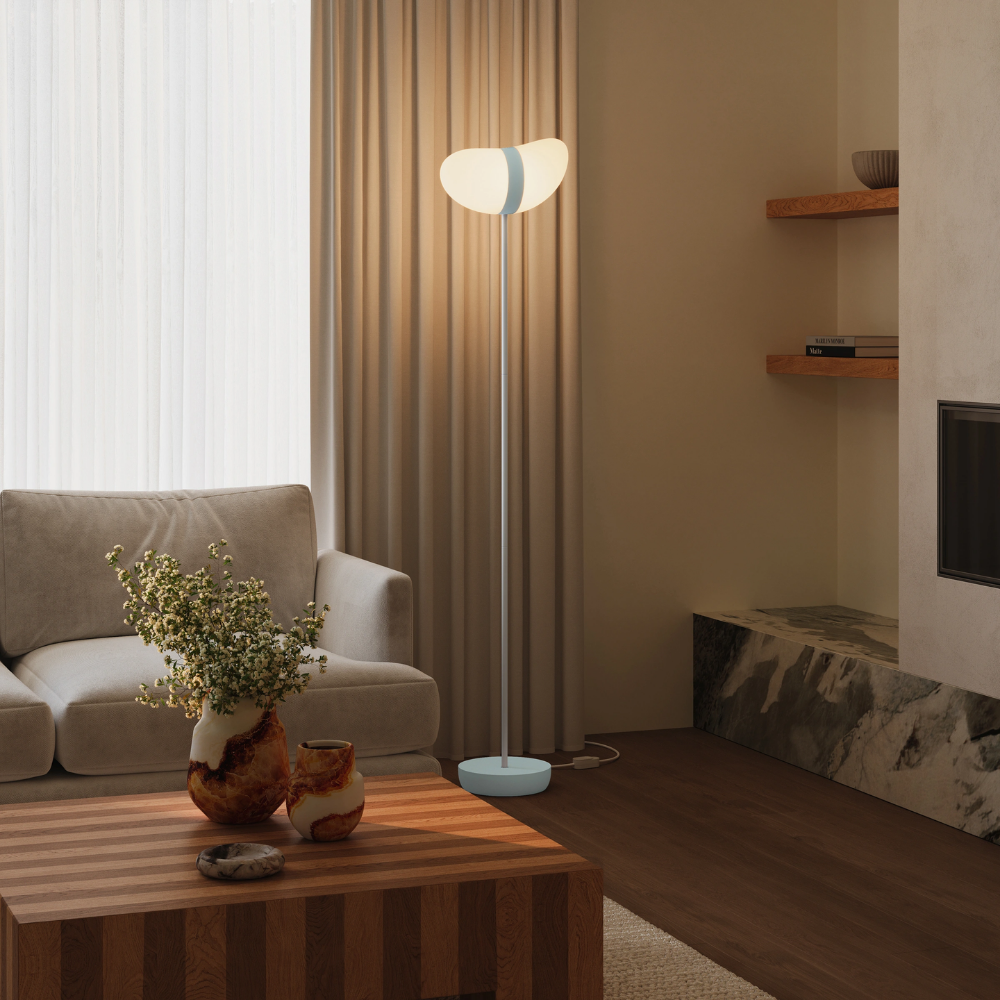 The sky Baltra Floor Light from Gantri with the white rod option in a lounge.