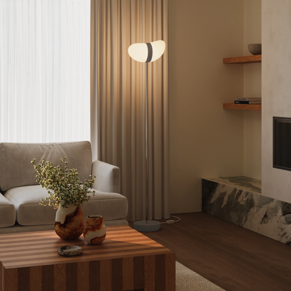 The smoke Baltra Floor Light from Gantri with the chrome rod option in a family space.