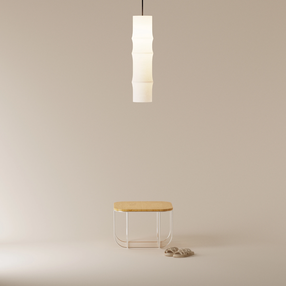 The Bamboo Large Pendant Light from Gantri with the black cord in a home office.