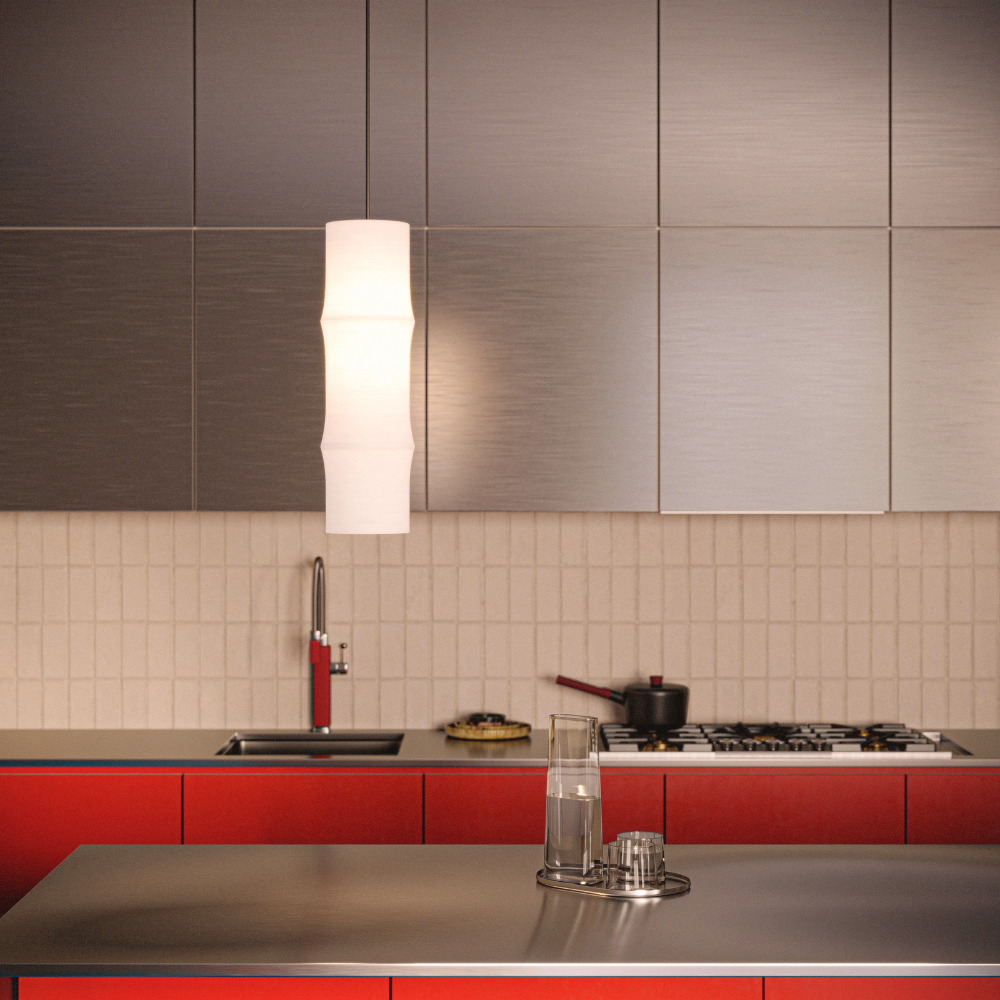 The Bamboo Medium Pendant Light from Gantri with the black cord in a modern kitchen with red cabinets.