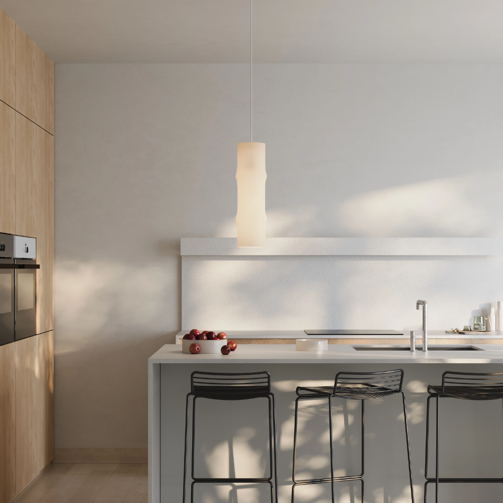 The Bamboo Medium Pendant Light from Gantri with the white cord in a living room.