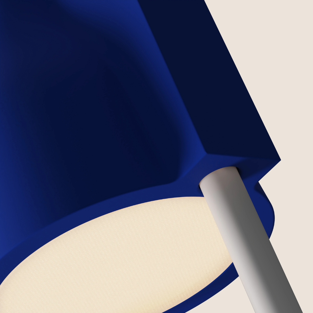 The cobalt Carve Floor Light from Gantri with the white rod option close up.