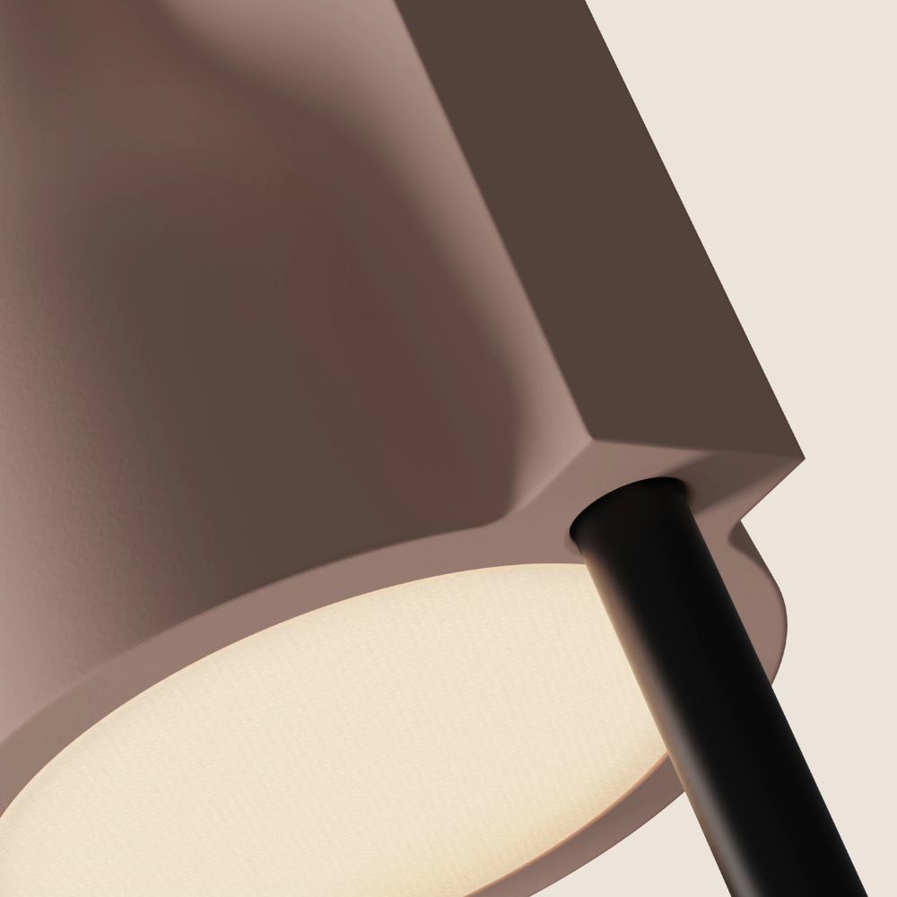 The coral Carve Floor Light from Gantri with the black rod option close up.