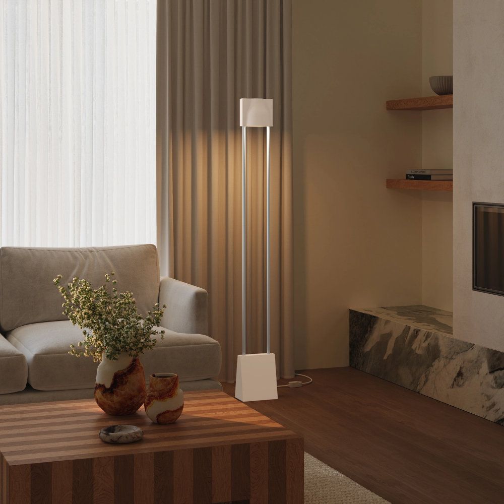 The peach Carve Floor Light from Gantri with the white rod option in a living space.