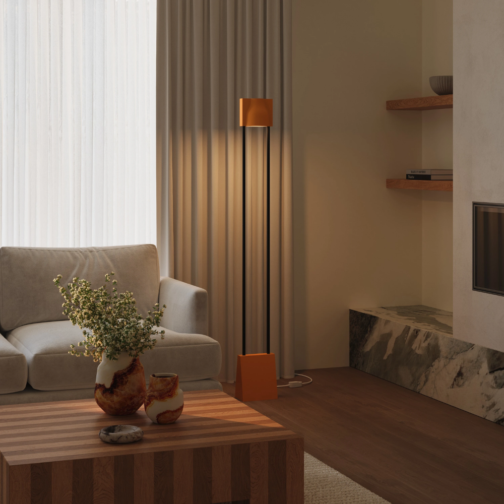 The persimmon Carve Floor Light from Gantri with the black rod option in a living room.