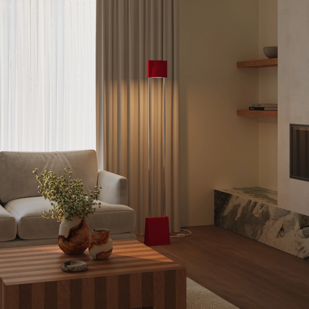 The poppy Carve Floor Light from Gantri with the chrome rod option in a family space.