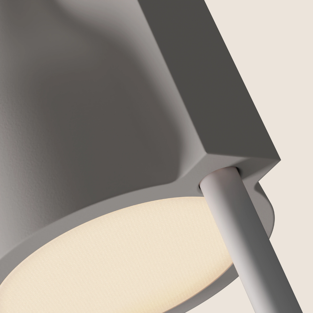 The stone Carve Floor Light from Gantri with the white rod option close up