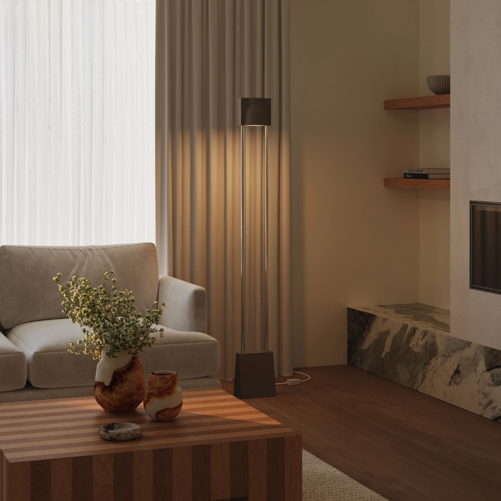 The walnut Carve Floor Light from Gantri with the chrome rod option in a family space.