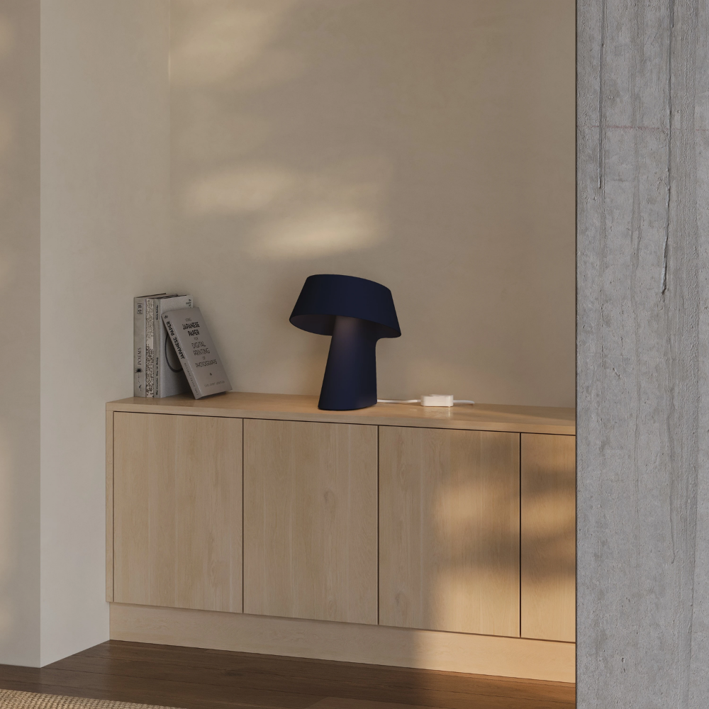 The carbon Fold Table Light from Gantri in a living room.