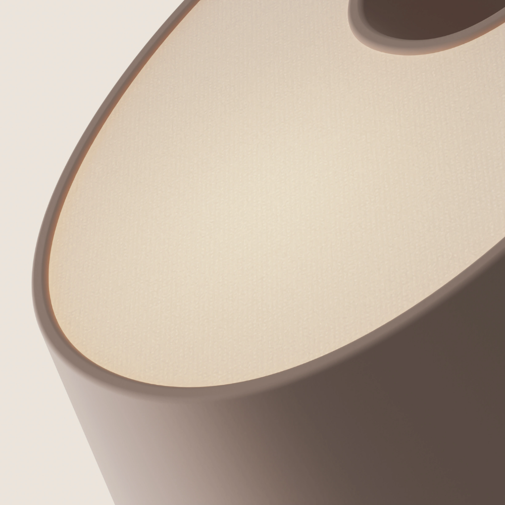 The coral Fold Table Light from Gantri close up.