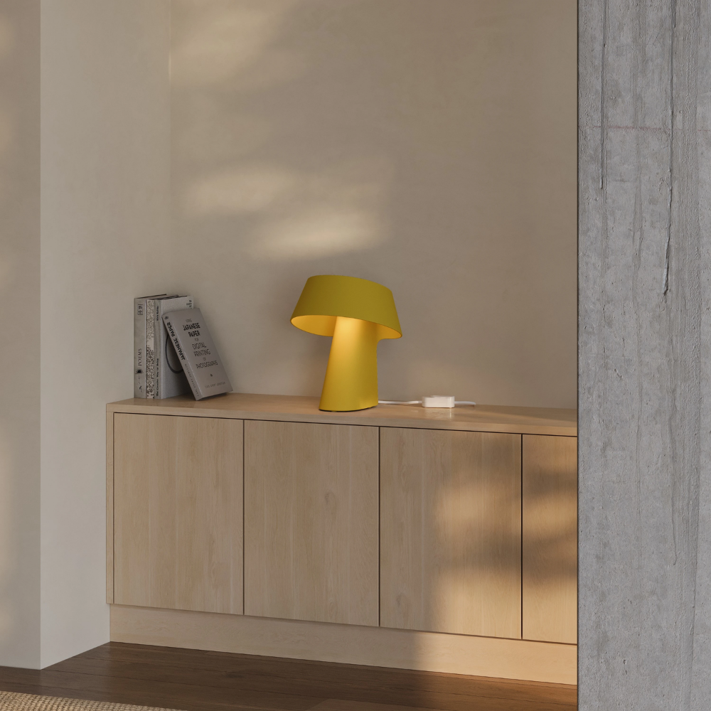 The mustard Fold Table Light from Gantri in a living room.