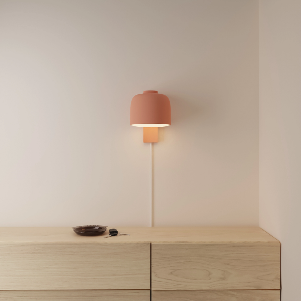 The blossom Gio Wall Light from Gantri in a primary bedroom.
