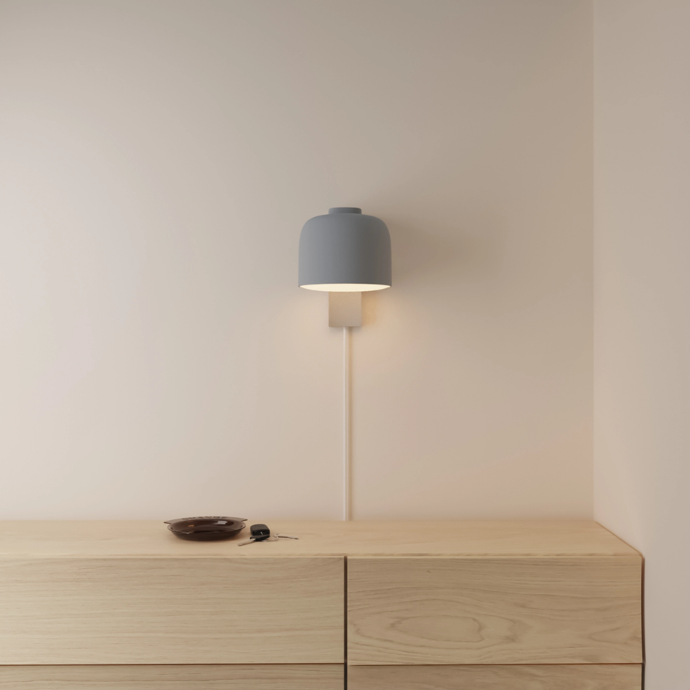 The fog Gio Wall Light from Gantri in a primary bedroom.