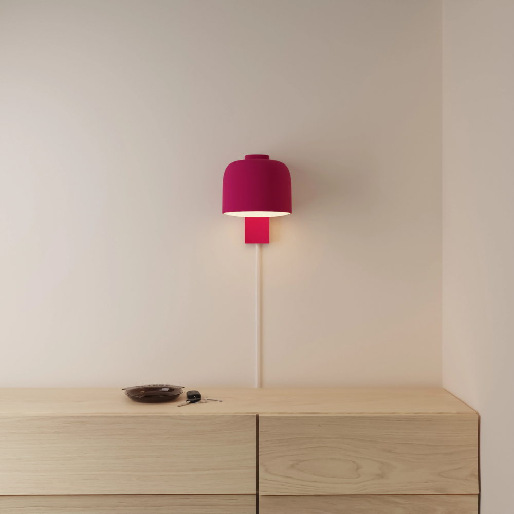 The hibiscus Gio Wall Light from Gantri in a primary bedroom.