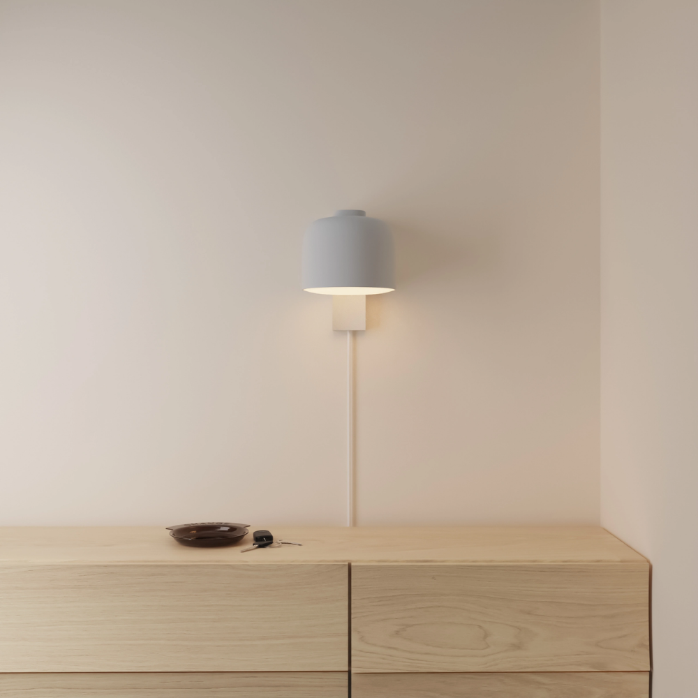 The mist Gio Wall Light from Gantri in a primary bedroom.