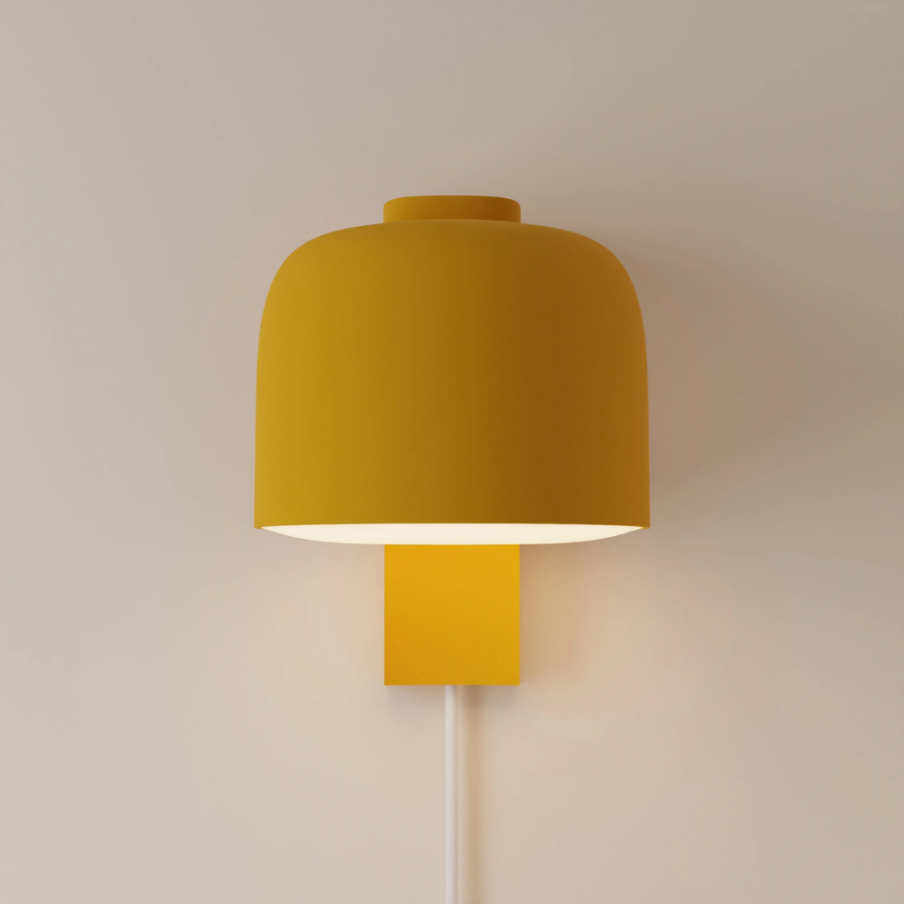 The mustard Gio Wall Light from Gantri.