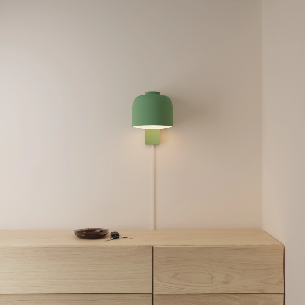 The sage Gio Wall Light from Gantri in a primary bedroom.