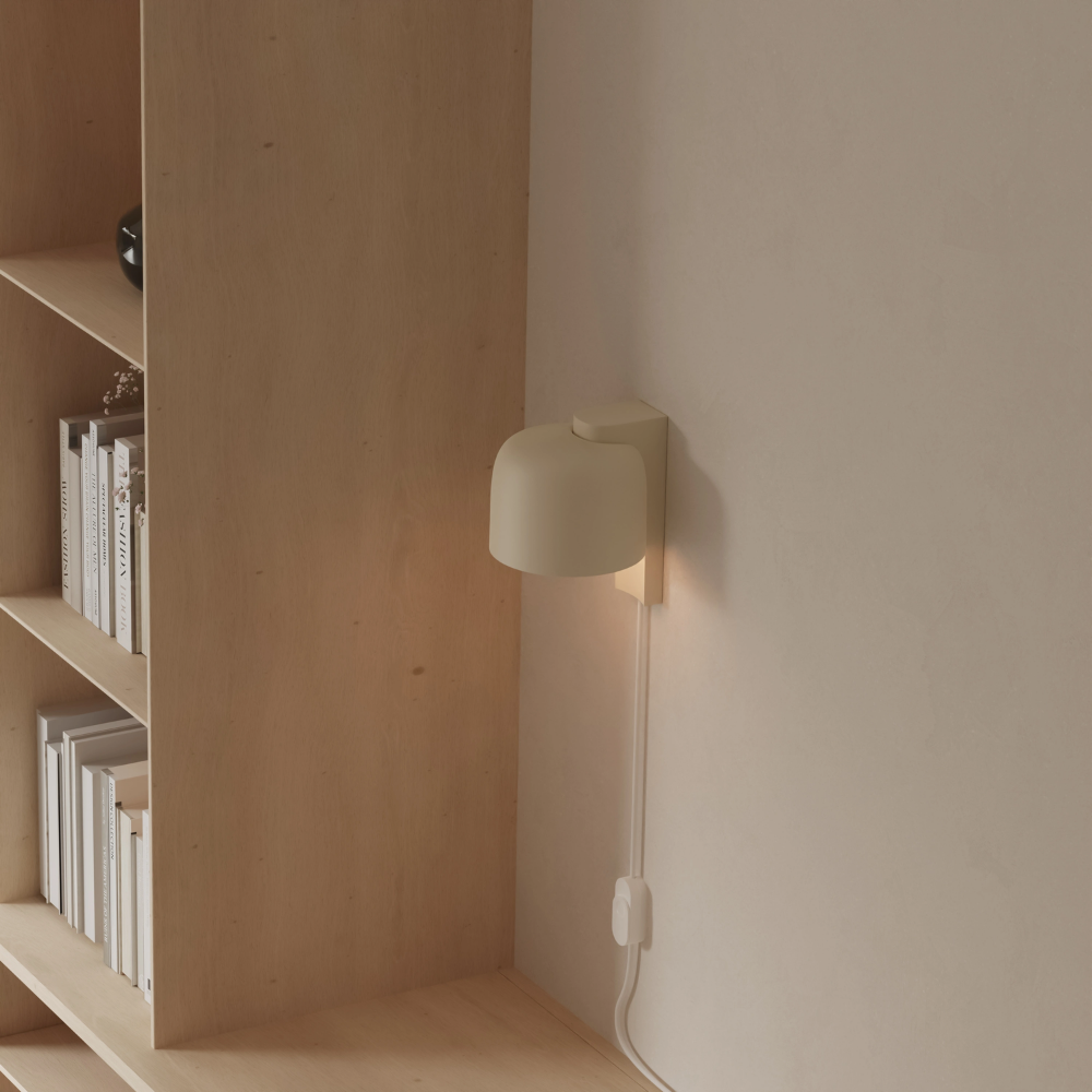 The sand Gio Wall Light from Gantri in a home office.