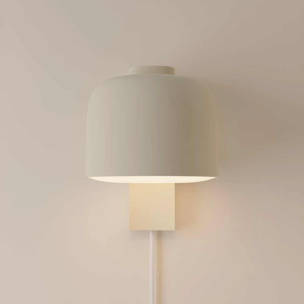The sand Gio Wall Light from Gantri in a studio.