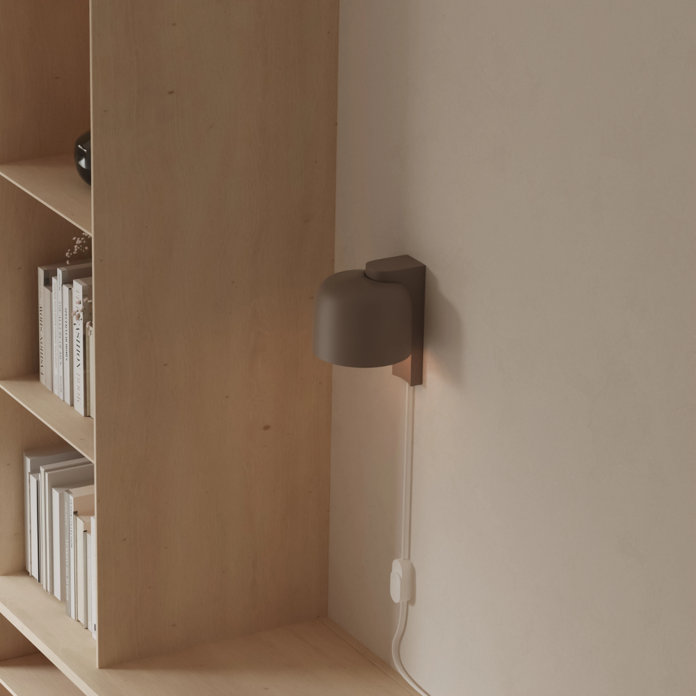 The smoke Gio Wall Light from Gantri in a home office.