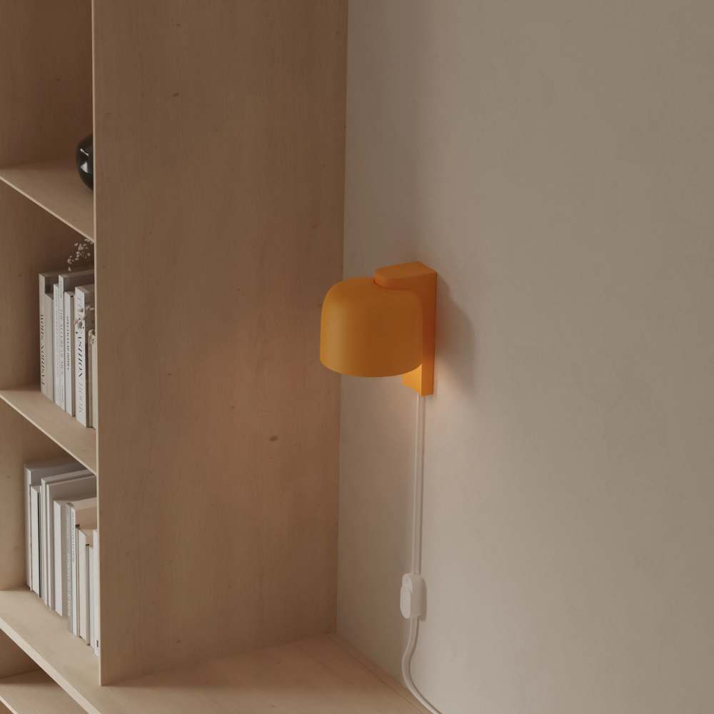 The sunrise Gio Wall Light from Gantri in a home office.