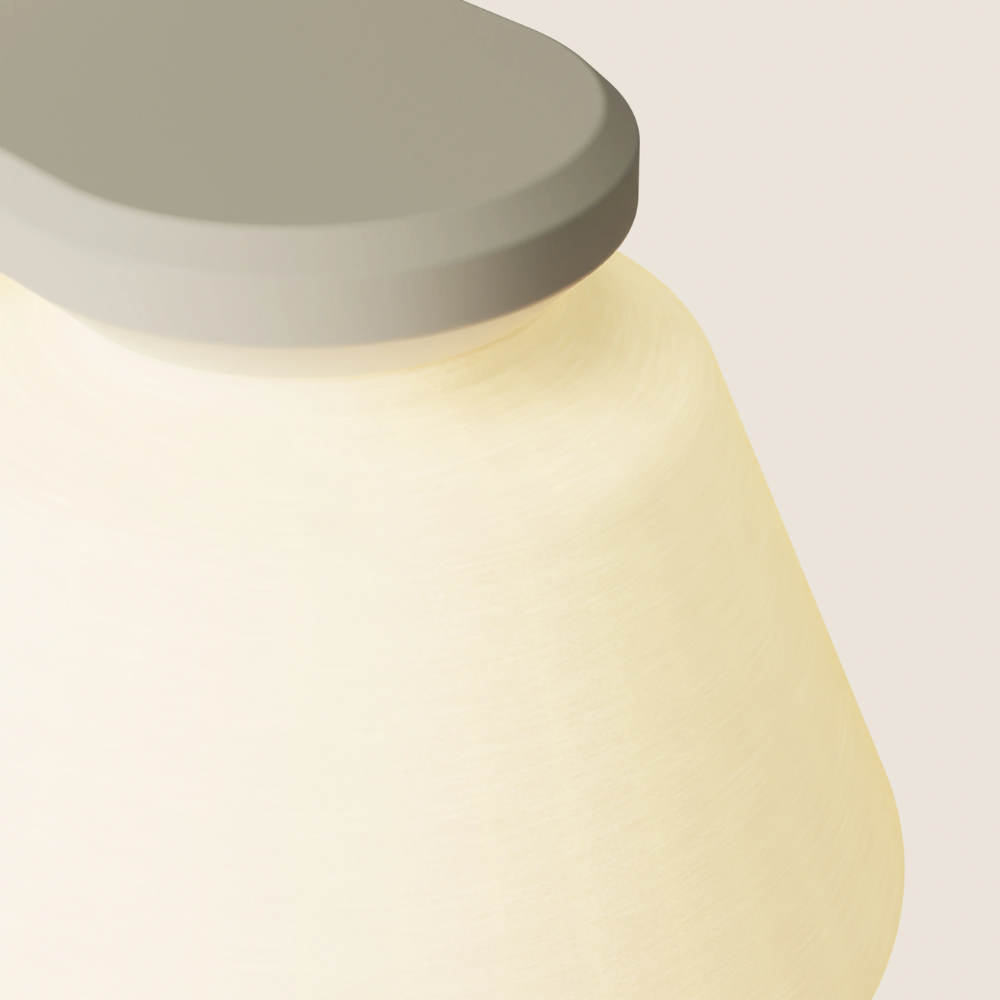 The sand Granada Wall Light from Gantri close up.