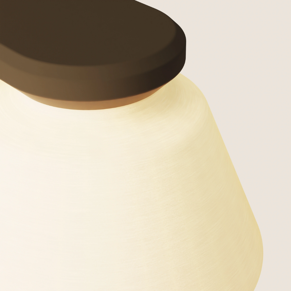 The walnut Granada Wall Light from Gantri close up.