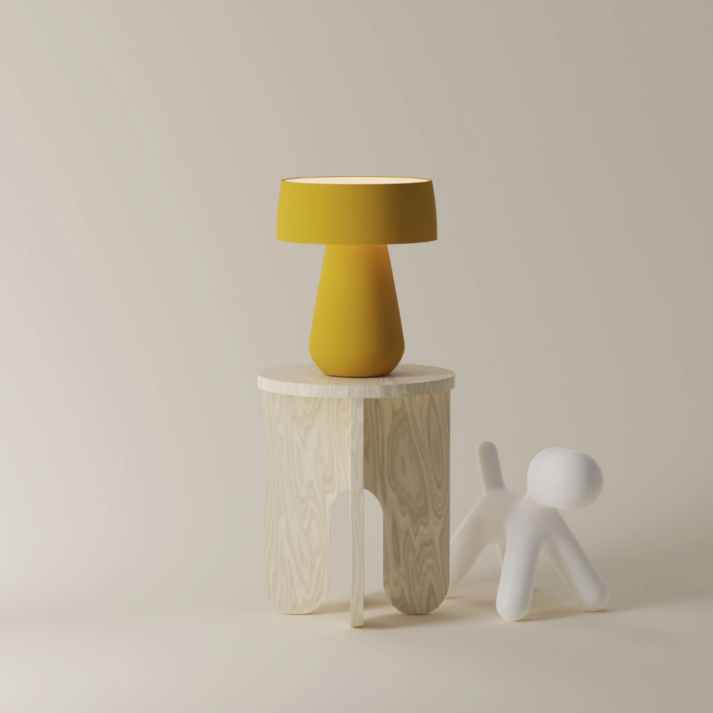 The mustard Hula Table Light from Gantri in a living room.