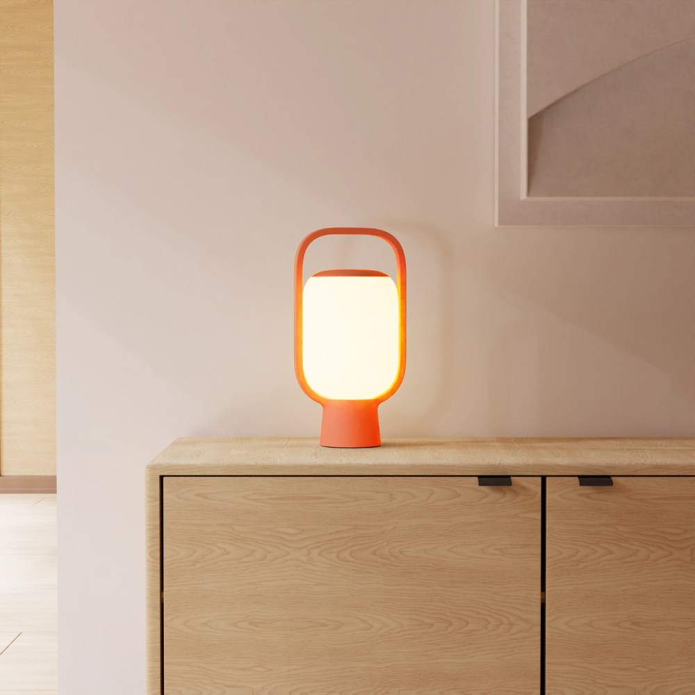 The persimmon Kero Table Light from Gantri in a family area.