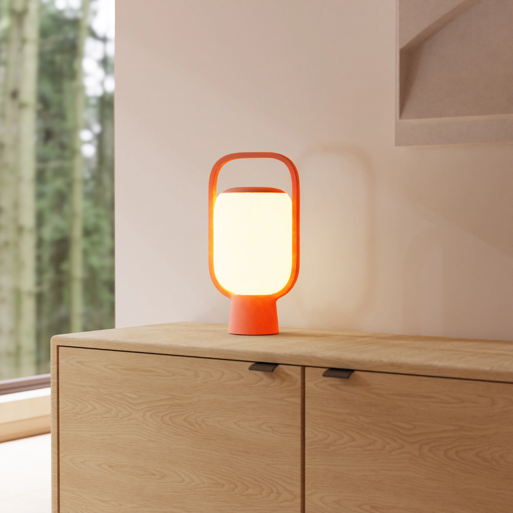 The persimmon Kero Table Light from Gantri in a living room.