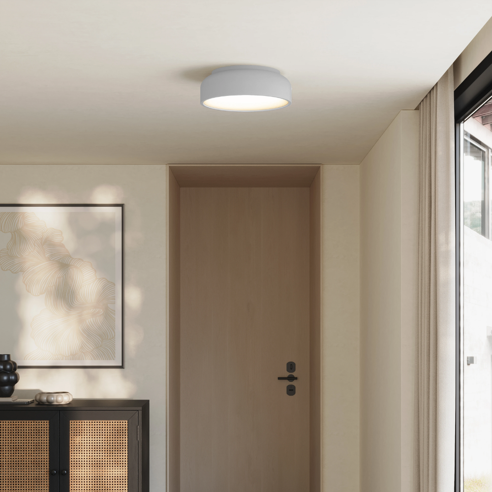 The fog Vitria Flush Mount from Gantri in a living room on the ceiling.
