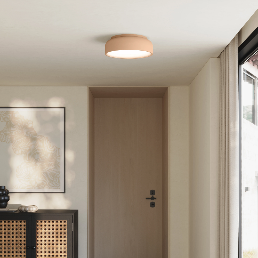 The peach Vitria Flush Mount from Gantri in a living room on the ceiling.