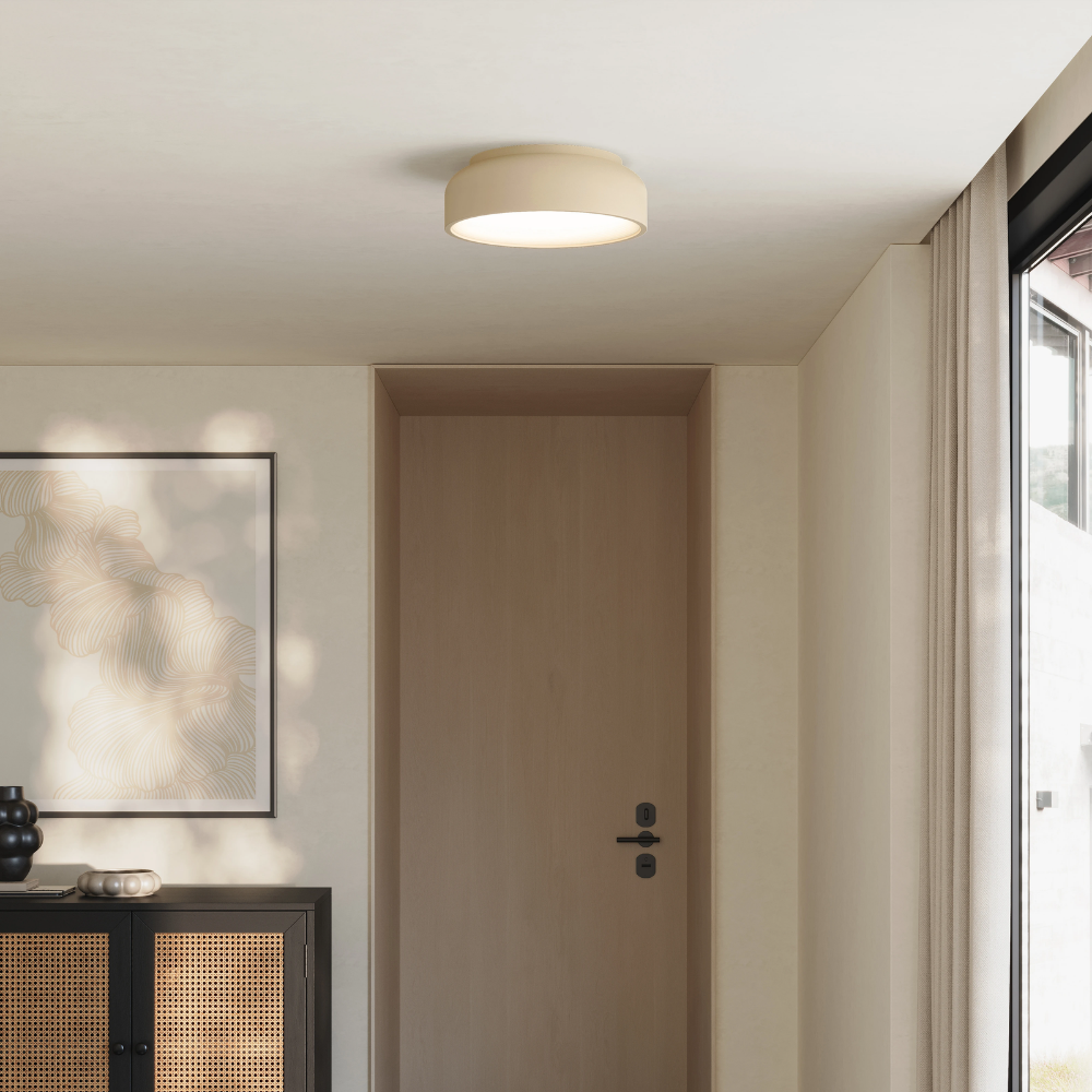 The sand Vitria Flush Mount from Gantri in a living room on the ceiling.