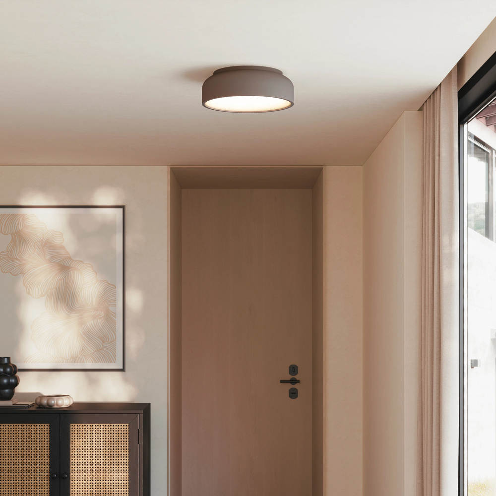 The smoke Vitria Flush Mount from Gantri in a living room on the ceiling.