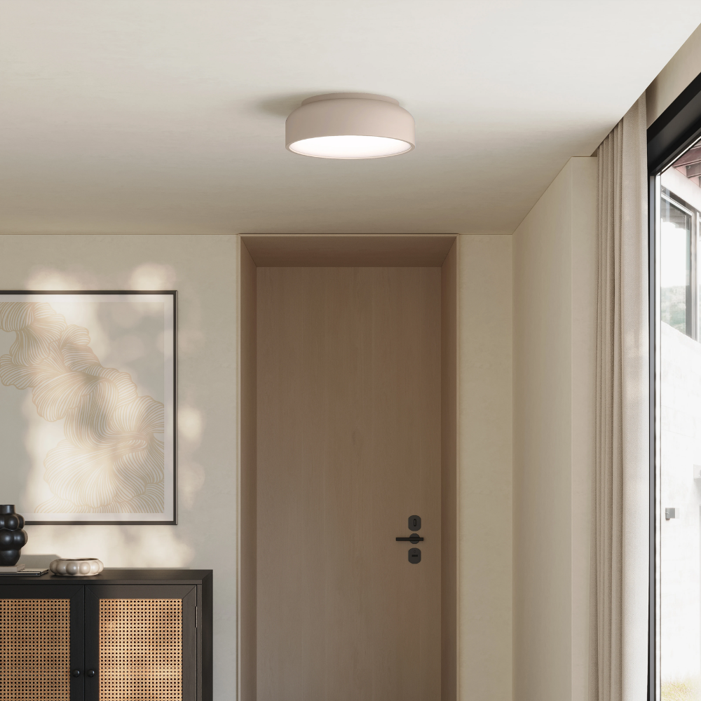 The stone Vitria Flush Mount from Gantri in a living room on the ceiling.