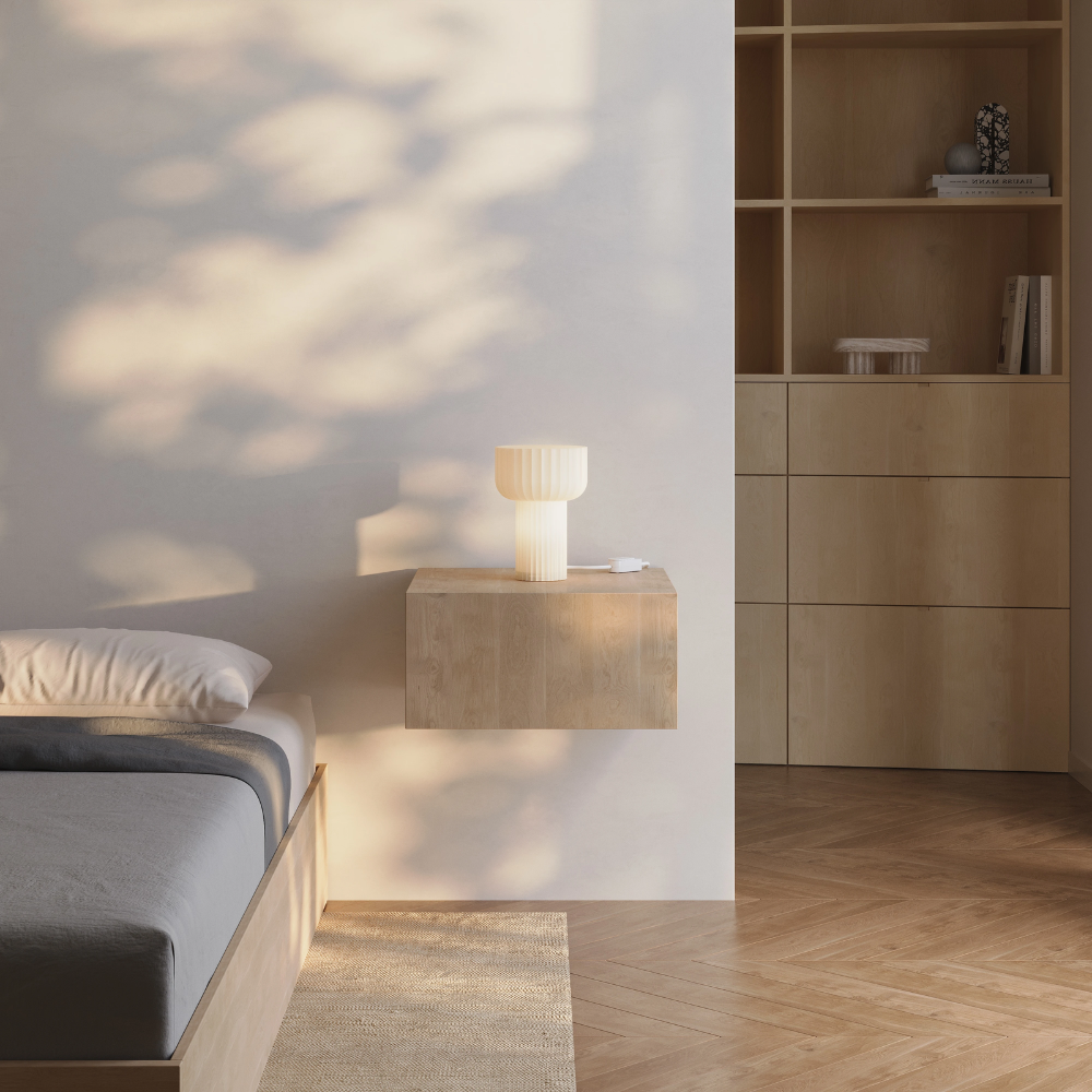 The Word Table Light from Gantri in a primary bedroom.