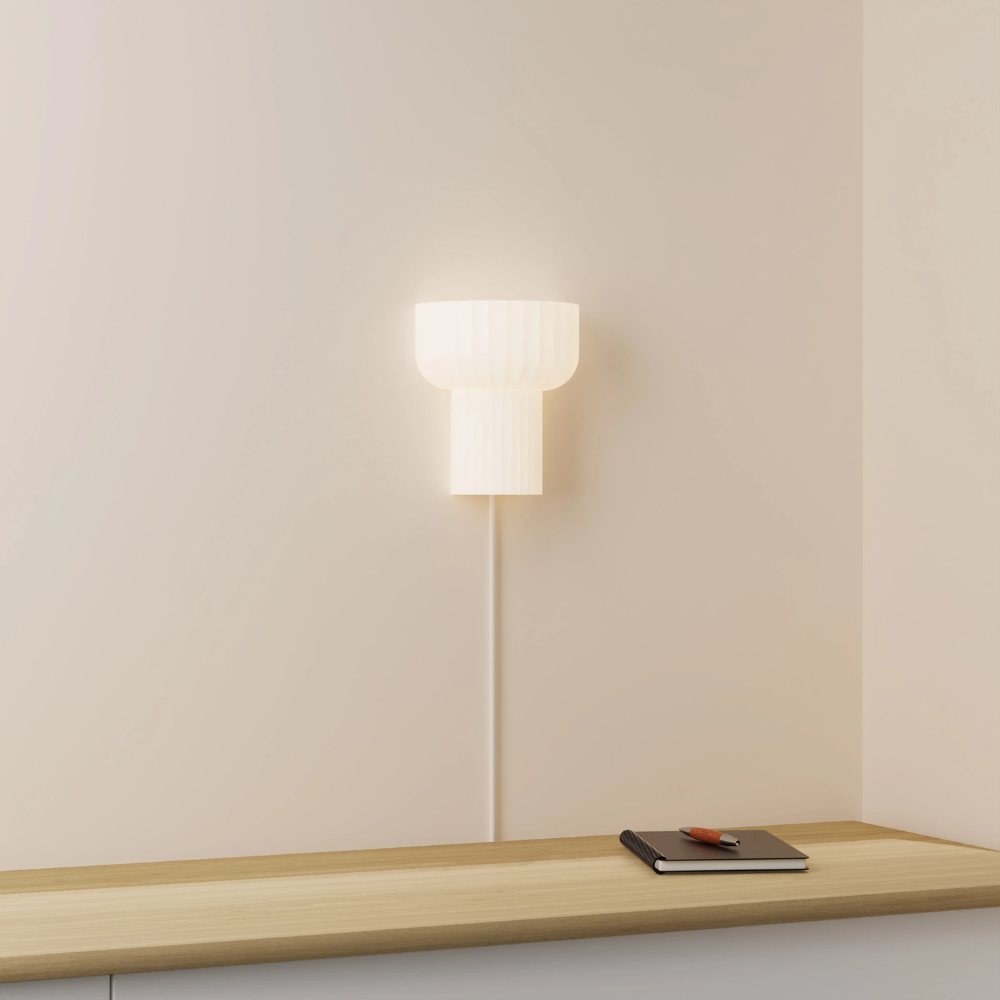 The white Word Wall Light from Gantri in a lounge.